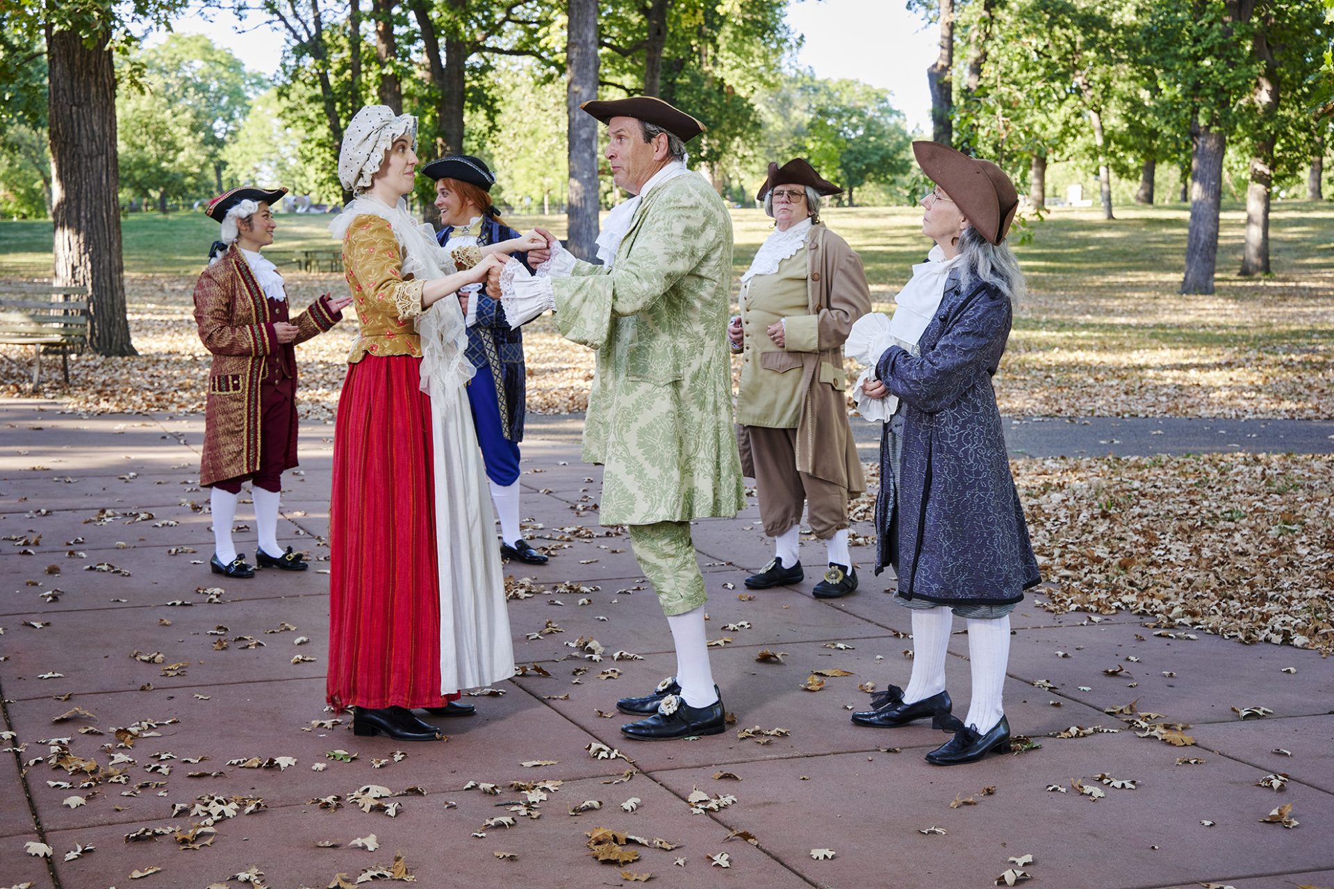 MORTON cast in period costume practicing a scene outdoors